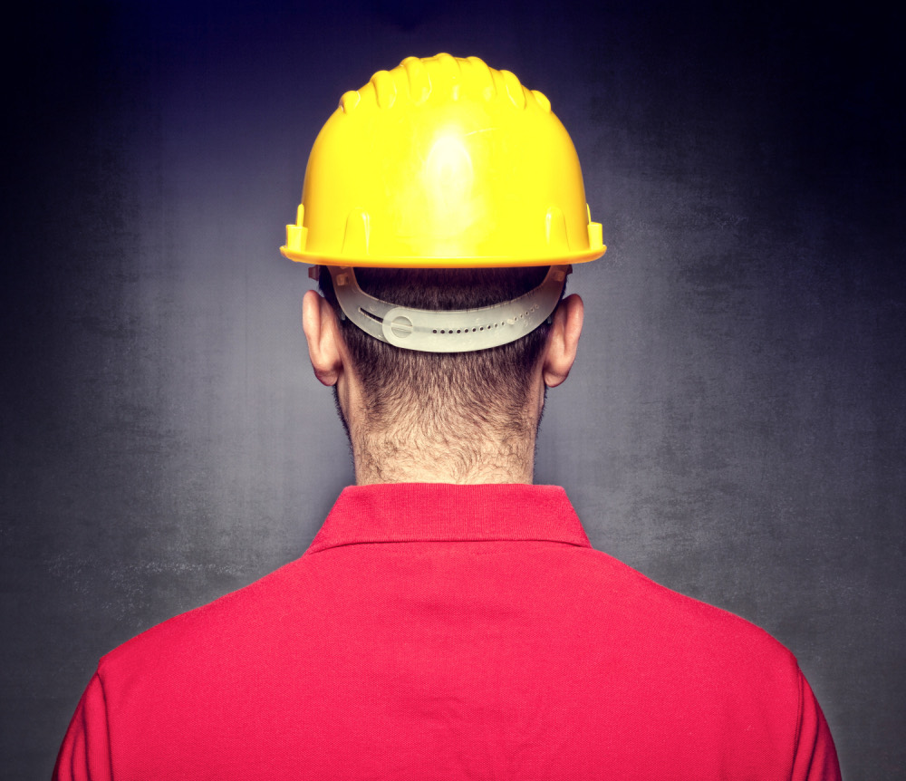 Construction worker wearing a high-visibility hard hat
